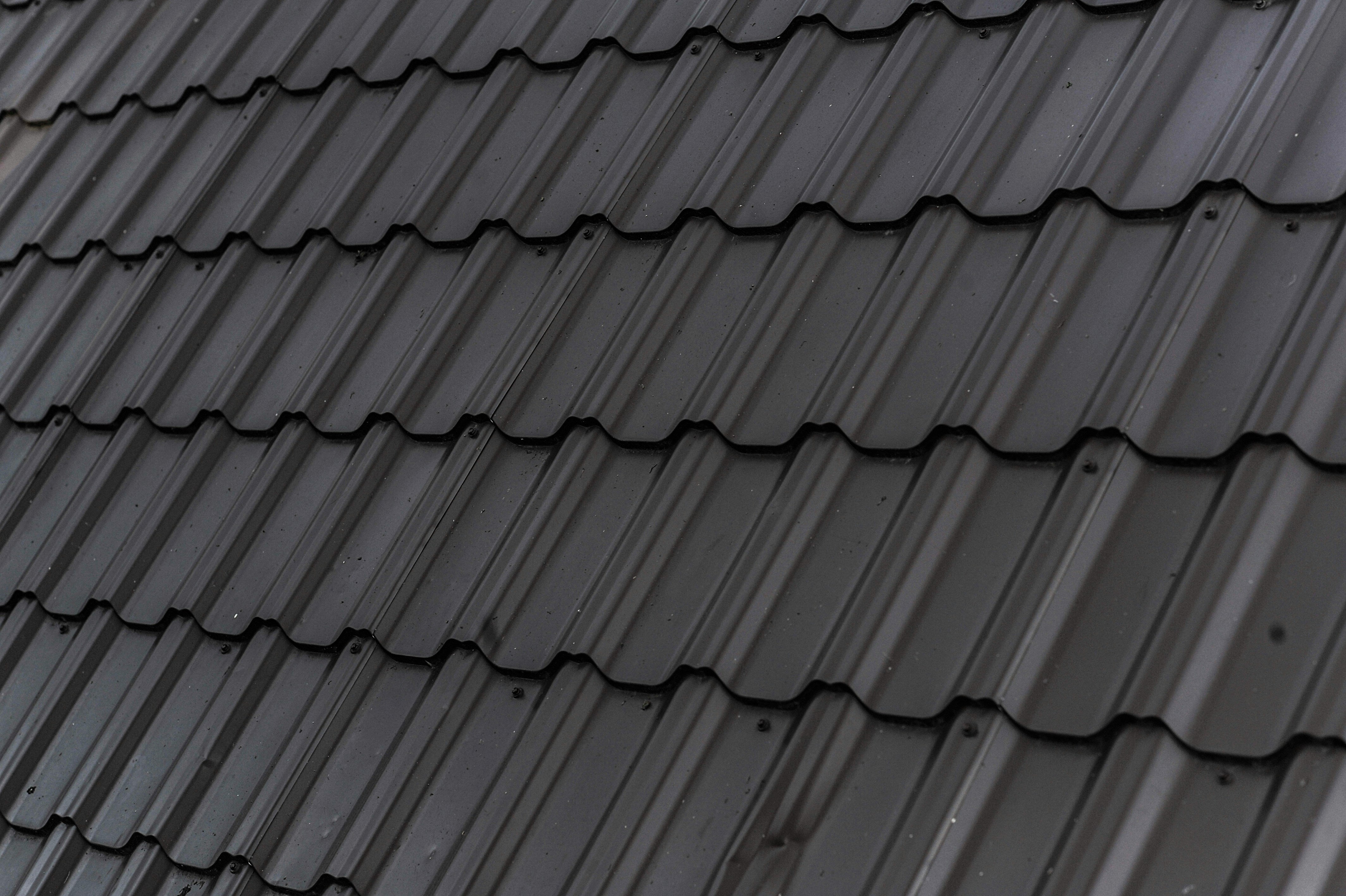 Close-up of a roof with dark gray tiles
